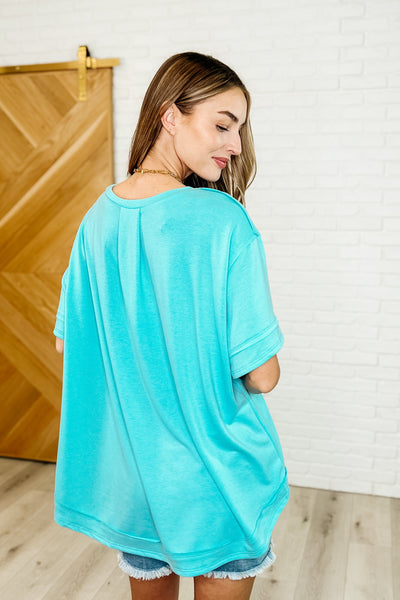 In the Rotation Exposed Seam Tee in Aqua