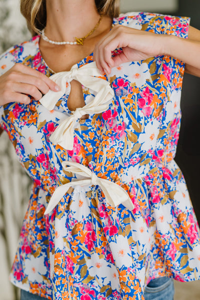 PREORDER: Sleeveless Bow Blouse in Pink and Orange Floral